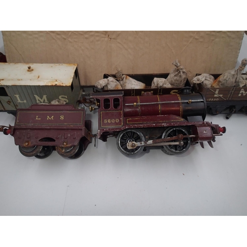 2179 - ***WITHDRAWN***Hornby O gauge, clockwork 0.4.0 locomotive and tender, LMS red, plus wagons, track et... 