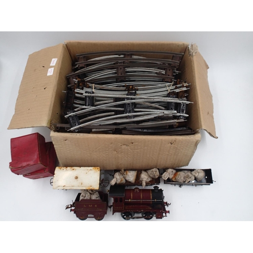 2179 - ***WITHDRAWN***Hornby O gauge, clockwork 0.4.0 locomotive and tender, LMS red, plus wagons, track et... 