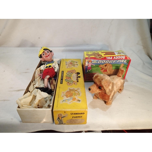 2430 - Boxed Pelham Puppet, Pinocchio, with original instructions and a boxed battery operated Doggy Pac, w... 