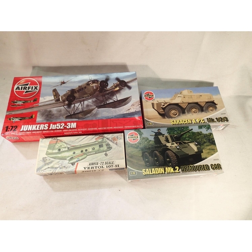 2357 - Four Airfix military related kits, Junker JU52, Vertol, Saladin and Saracen, all appear complete, un... 