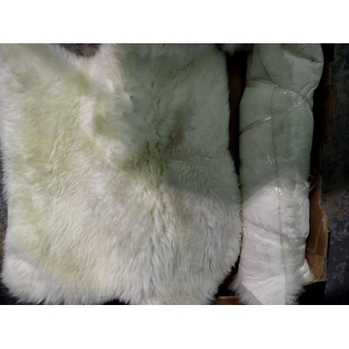 1182 - Two sheepskin, white, woollen rugs. Not available for in-house P&P