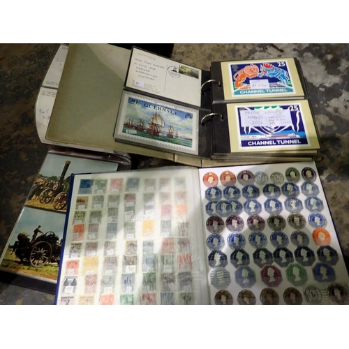 1225 - Two albums of postcards with a further album of world stamps. Not available for in-house P&P