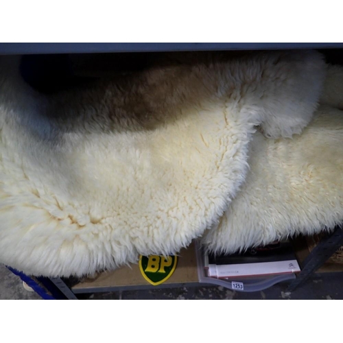 1250 - Group of three sheepskin rugs. Not available for in-house P&P