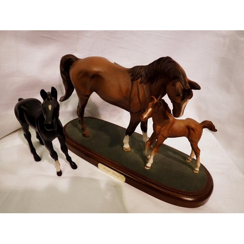 1271 - Royal Doulton figural horse group, First Born, on wooden plinth, together with a Beswick Black Beaut... 