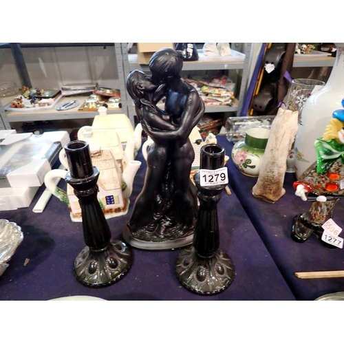 1279 - Sculpture of a man and woman embracing and two candlesticks. Not available for in-house P&P