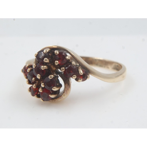 21 - 9ct gold garnet set cluster ring, size M, 3.1g. UK P&P Group 2 (£20+VAT for the first lot and £4+VAT... 