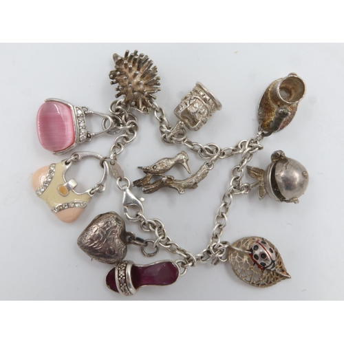 6 - 925 silver charm bracelet with ten charms, including a hedgehog charm. UK P&P Group 0 (£6+VAT for th... 