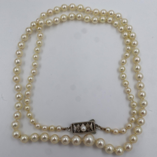 61 - Cased vintage set of Mikimoto pearls, a graduated set, 52cm L, in original box. UK P&P Group 1 (£16+... 