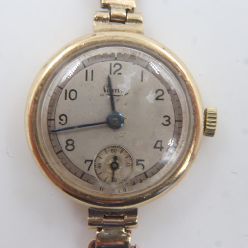 64 - LIMIT: Ladies 9ct gold cased wristwatch on a yellow metal bracelet. UK P&P Group 1 (£16+VAT for the ... 