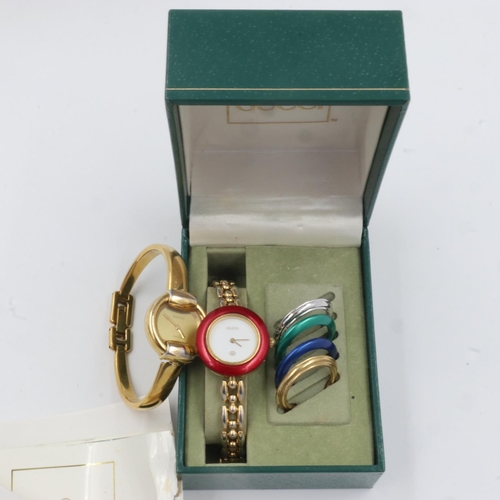 73 - GUCCI: ladies quartz wristwatch with changeable coloured bezels, boxed with guarantee card from Bood... 