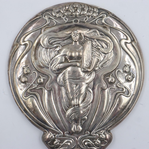 76 - An Art Nouveau hallmarked silver hand mirror, with figural design in relief, plaster filled, marks i... 