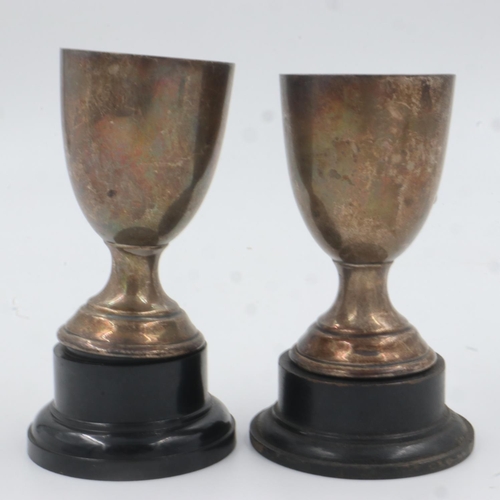 79 - Two sterling silver trophies, with black plinths, silver combined 92g. UK P&P Group 2 (£20+VAT for t... 