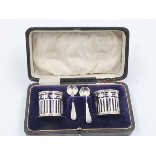 90 - Hallmarked silver cruet set, two open salts with blue glass liners, with spoons, boxed. UK P&P Group... 