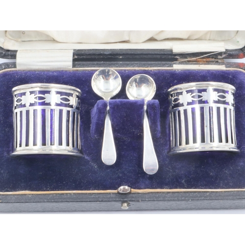 90 - Hallmarked silver cruet set, two open salts with blue glass liners, with spoons, boxed. UK P&P Group... 