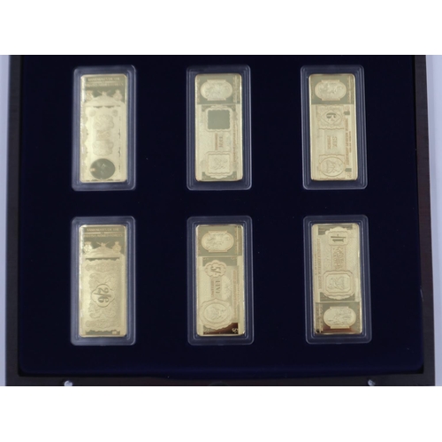 148 - Six gold plated ingots of the bank notes of the British Armed Forces in presentation case. UK P&P Gr... 