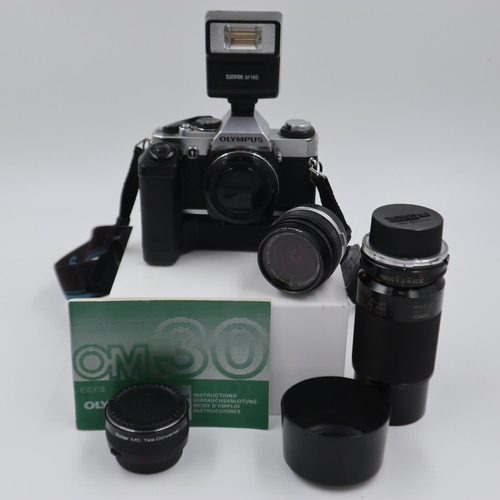 155 - Olympus OM20 camera with additional aftermarket lenses and flash. UK P&P Group 2 (£20+VAT for the fi... 