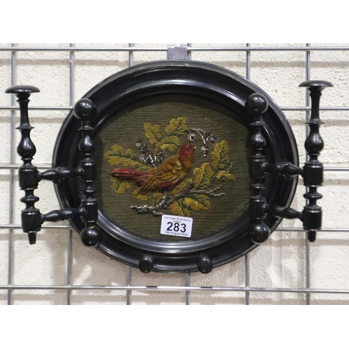 283 - Victorian ebonised oval framed beadwork panel with hinged hanging brackets and hanging pegs to the l... 