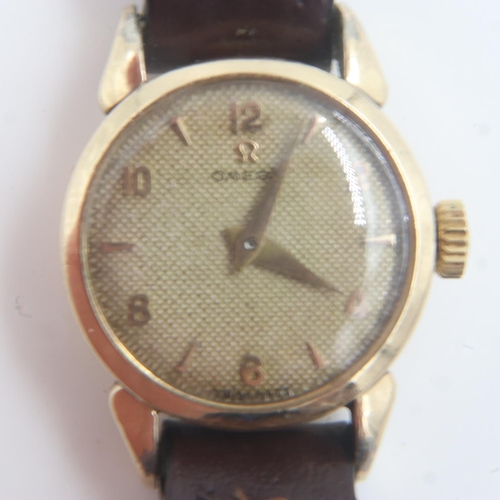 71A - OMEGA: ladies gold plated wristwatch on brown leather strap. UK P&P Group 1 (£16+VAT for the first l... 