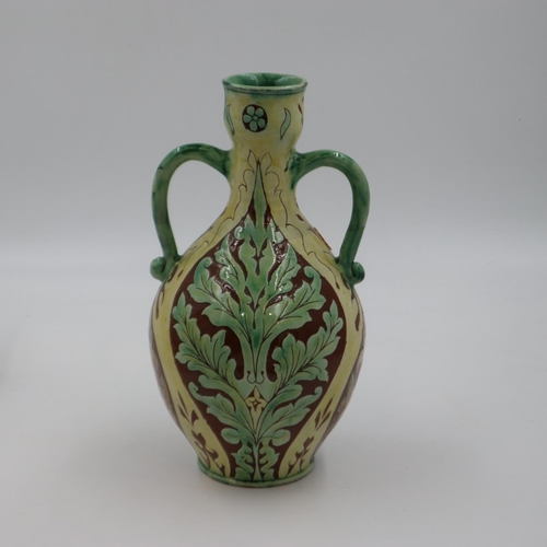 193 - Della Robbia (Birkenhead): a large twin handled urn, sgraffitto decorated throughout with floral des... 