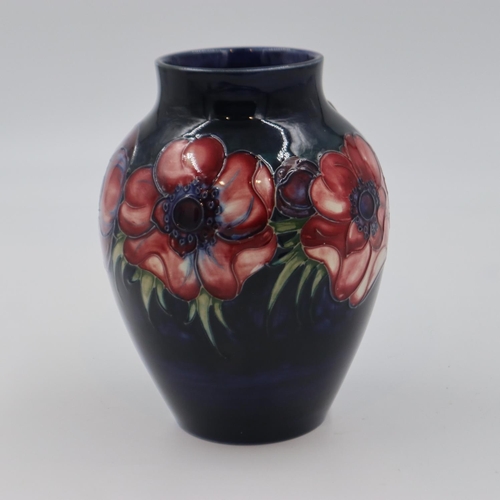 195 - Moorcroft vase in the Anemone pattern on a cobalt blue ground, original paper label to base, 18cm H.... 