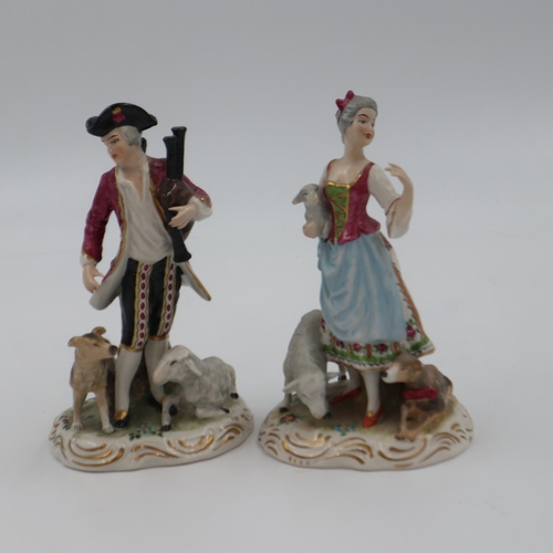 201 - A pair of 19th century figures in the manner of Meissen, each with animals, minor losses to the fema... 