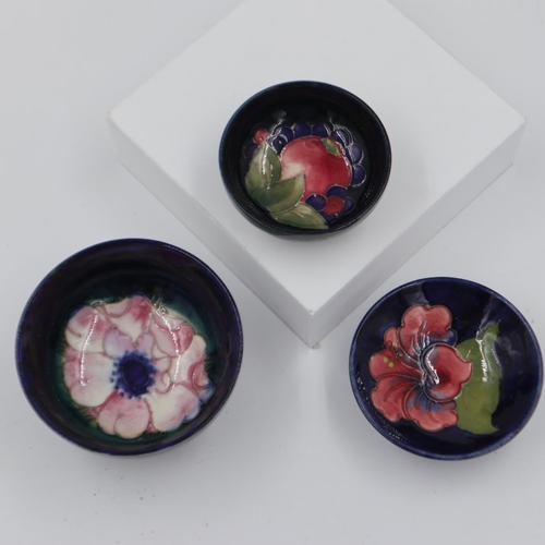 218 - Trio of Moorcroft small footed bowls in the Hibiscus, Pomegranate and Anemone patterns, largest 11cm... 