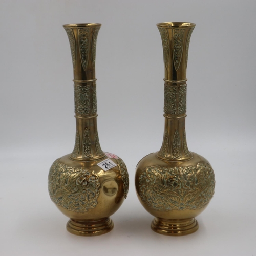 261 - A pair of large cast brass temple-form vases, decorated in relief, each H: 42 cm. dent to one body. ... 