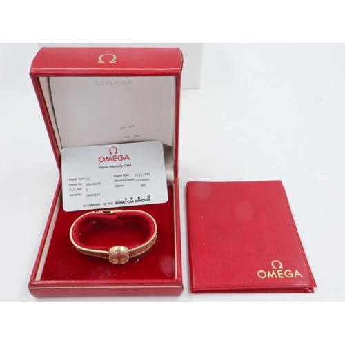 74 - OMEGA: ladies 9ct gold cased wristwatch with 9ct gold bracelet, boxed with paperwork dating the watc... 