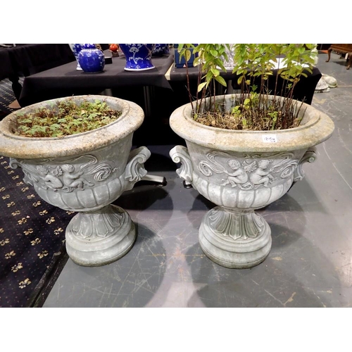 1810M - A pair of large and impressive reconstituted stone pedestal urn planters, decorated in relief with c... 