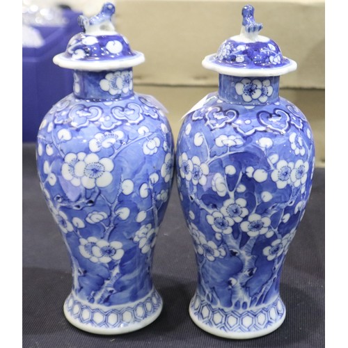 264 - A pair of Chinese 19th century covered vases, each decorated in the prunus pattern, H: 22 cm, no mar... 