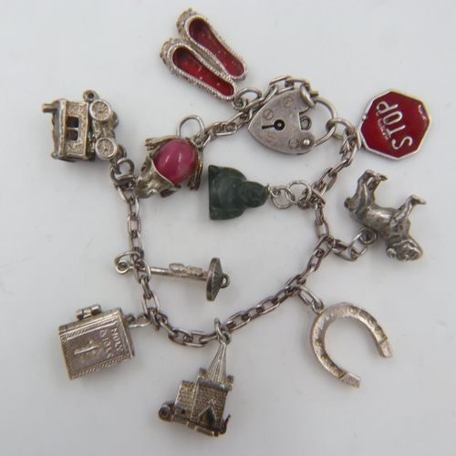 47 - 925 silver charm bracelet with ten charms. UK P&P Group 0 (£6+VAT for the first lot and £1+VAT for s... 