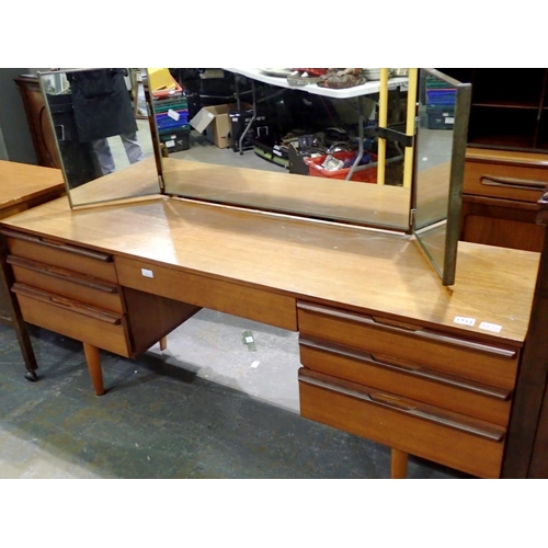 1713 - Teak dressing table with three way mirror and seven drawers, H: 66 x W: 163 cm, generally good order... 