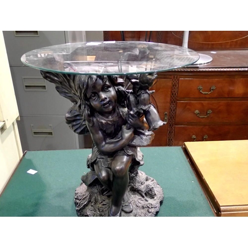 1715 - Coffee table with glass top, the base being a depiction of a fairy, 47 x 51 cm H. Not available for ... 