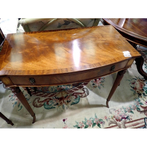 1738 - Bow fronted mahogany fronted table on tapering supports, 81 x 72 cm H. Not available for in-house P&... 