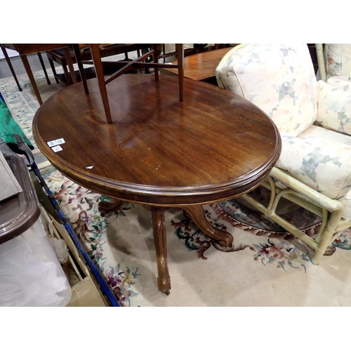 1740 - A 19th century oval loo table, with tilting top and carved quadripartite support, 119 x 88 x 75 cm H... 