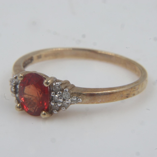 72 - 9ct gold red sapphire set ring with diamond set shoulders, size O, 1.6g. UK P&P Group 0 (£6+VAT for ... 