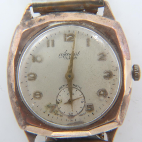 95 - ACCURIST: 9ct gold gents manual wind wristwatch, with 1957 Evening Express inscription, on an expand... 