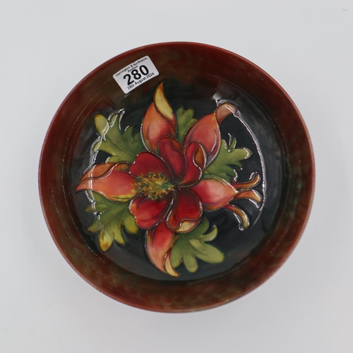 280 - Moorcroft flambe footed bowl, in the Columbine pattern, D: 23.5cm. UK P&P Group 2 (£20+VAT for the f... 