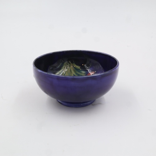 290 - Moorcroft footed bowl, in the Freesia pattern on cobalt blue ground, D: 10.5cm. UK P&P Group 1 (£16+... 