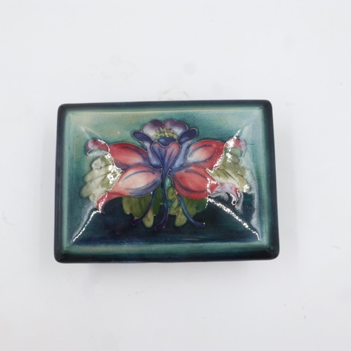 301 - Moorcroft rectangular lidded trinket box in the Columbine pattern on graduated green/blue ground. L:... 