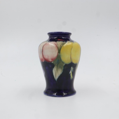 334 - Moorcroft vase in the Wisteria pattern on cobalt blue ground. H: 9cm. UK P&P Group 1 (£16+VAT for th... 