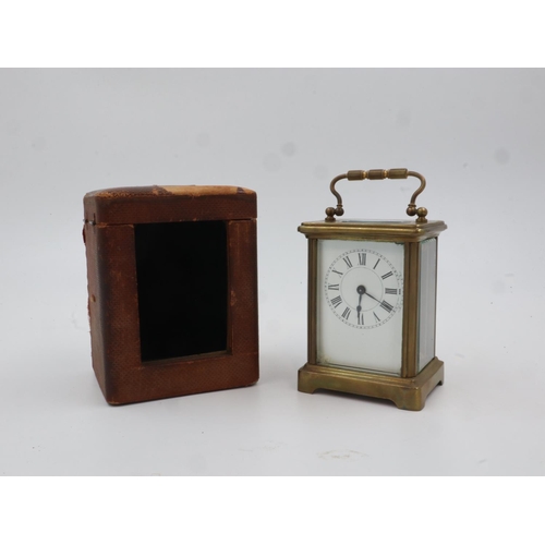 368 - Cased brass carriage clock with key. UK P&P Group 2 (£20+VAT for the first lot and £4+VAT for subseq... 