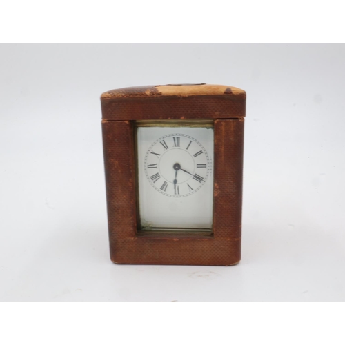 368 - Cased brass carriage clock with key. UK P&P Group 2 (£20+VAT for the first lot and £4+VAT for subseq... 