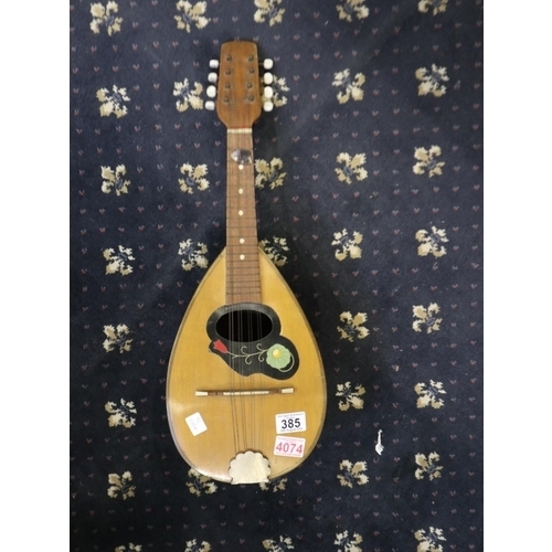 385 - Francesco Catania mandolin, original paper label to interior, L: 32cm. Not available for in-house P&... 