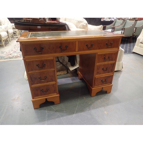 1742A - Reproduction Yew wood and walnut eight drawer pedestal desk with green tooled leather insert to top,... 