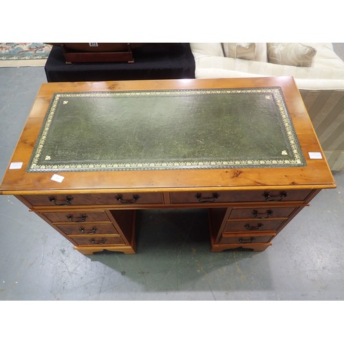 1742A - Reproduction Yew wood and walnut eight drawer pedestal desk with green tooled leather insert to top,... 