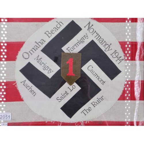 2051 - Memento of a soldier in the US 1st Infantry Division. A German NSDAP Flag centre mounted on a fragme... 