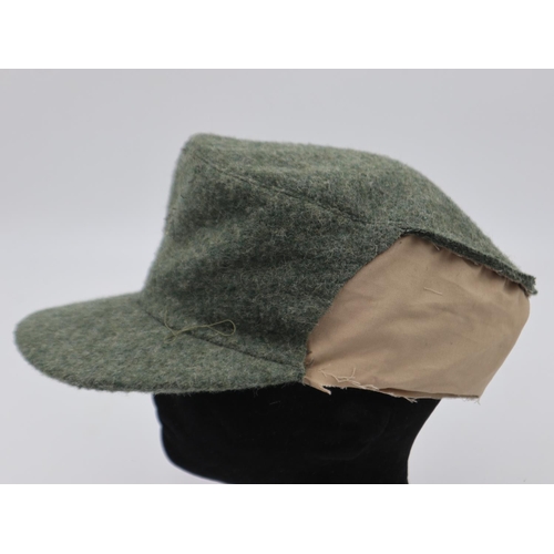 2103 - German Mountain Troops M43 cap, large portion removed, liner dated 1944. UK P&P Group 2 (£20+VAT for... 