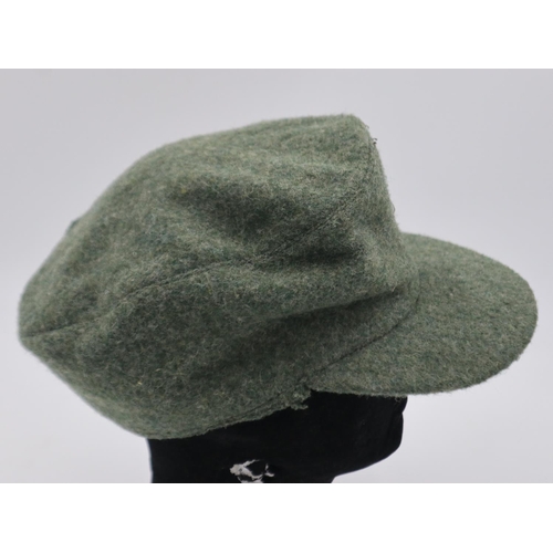 2103 - German Mountain Troops M43 cap, large portion removed, liner dated 1944. UK P&P Group 2 (£20+VAT for... 