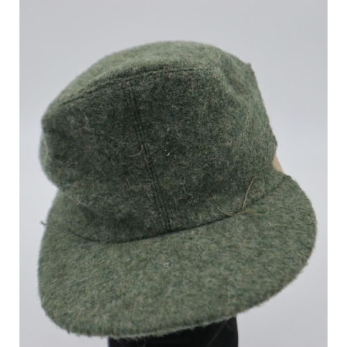 2103 - German Mountain Troops M43 cap, large portion removed, liner dated 1944. UK P&P Group 2 (£20+VAT for... 